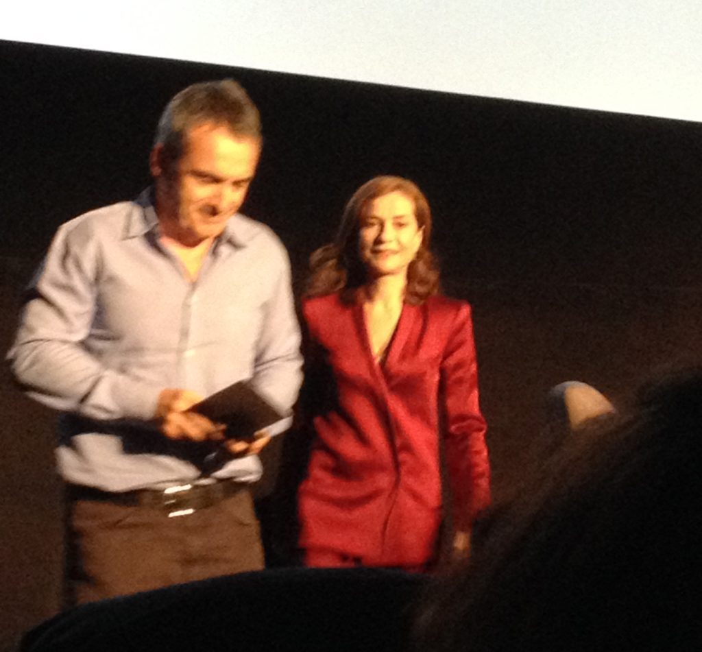 The moderator of the Q&A and Isabelle Huppert.