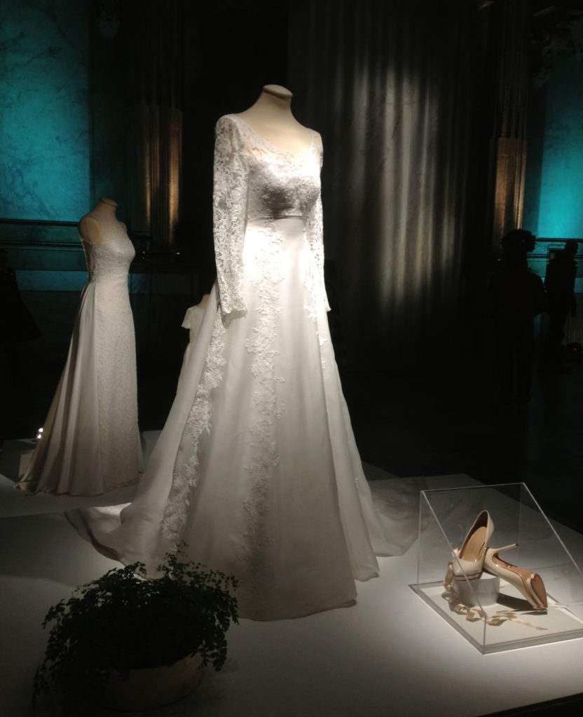 Princess Sofia's wedding dress, designed by Ida Sjöstedt, and the shoes she wore (notice the heart shaped sole!). In the background the dress she wore at the party.