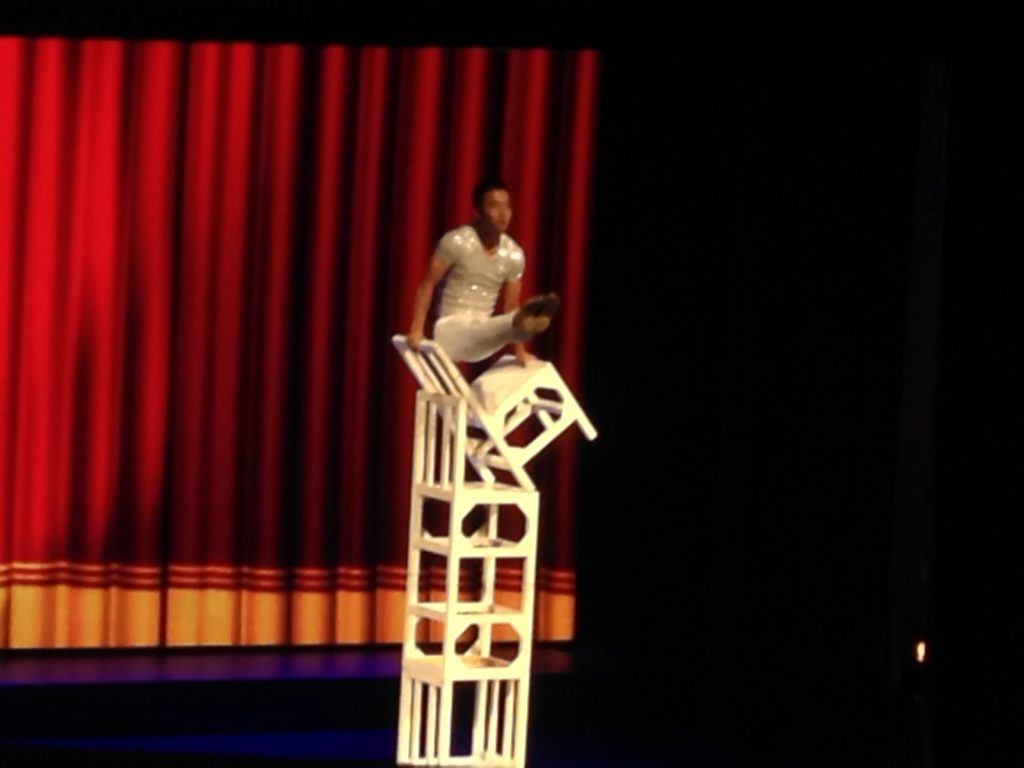 The acrobat knew how to work with his chairs.