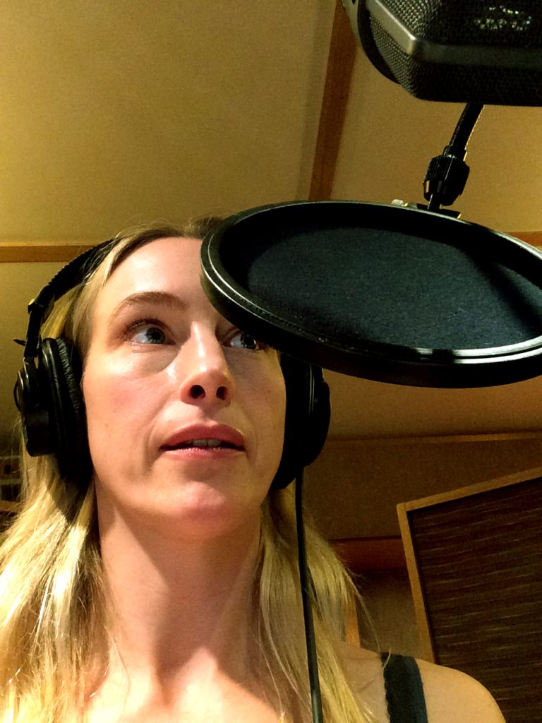 In the recording studio doing voice overs.